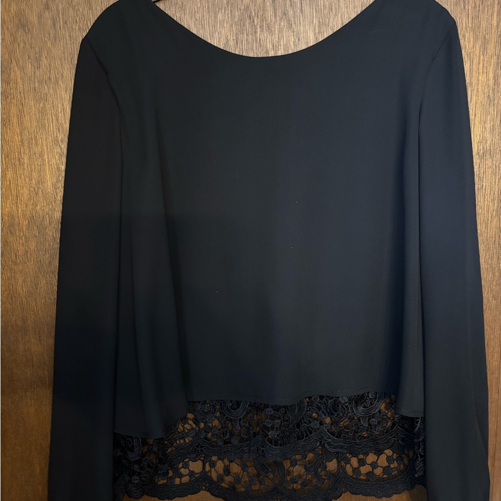 Elegant Black Lace Hem Blouse. Scalloped back with lace underlay.